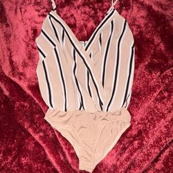 women’s small striped beige crossover bodysuit with adjustable straps and snap bottom
