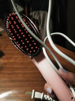 Hot brush straightener.