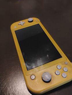 Nintendo Switch Lite (With Super Smash bros)