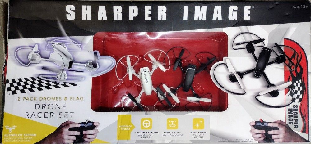 Sharper Image Dual 2 Pack Drones & Flag Racer Drone Set. New in Box. Retail $128.