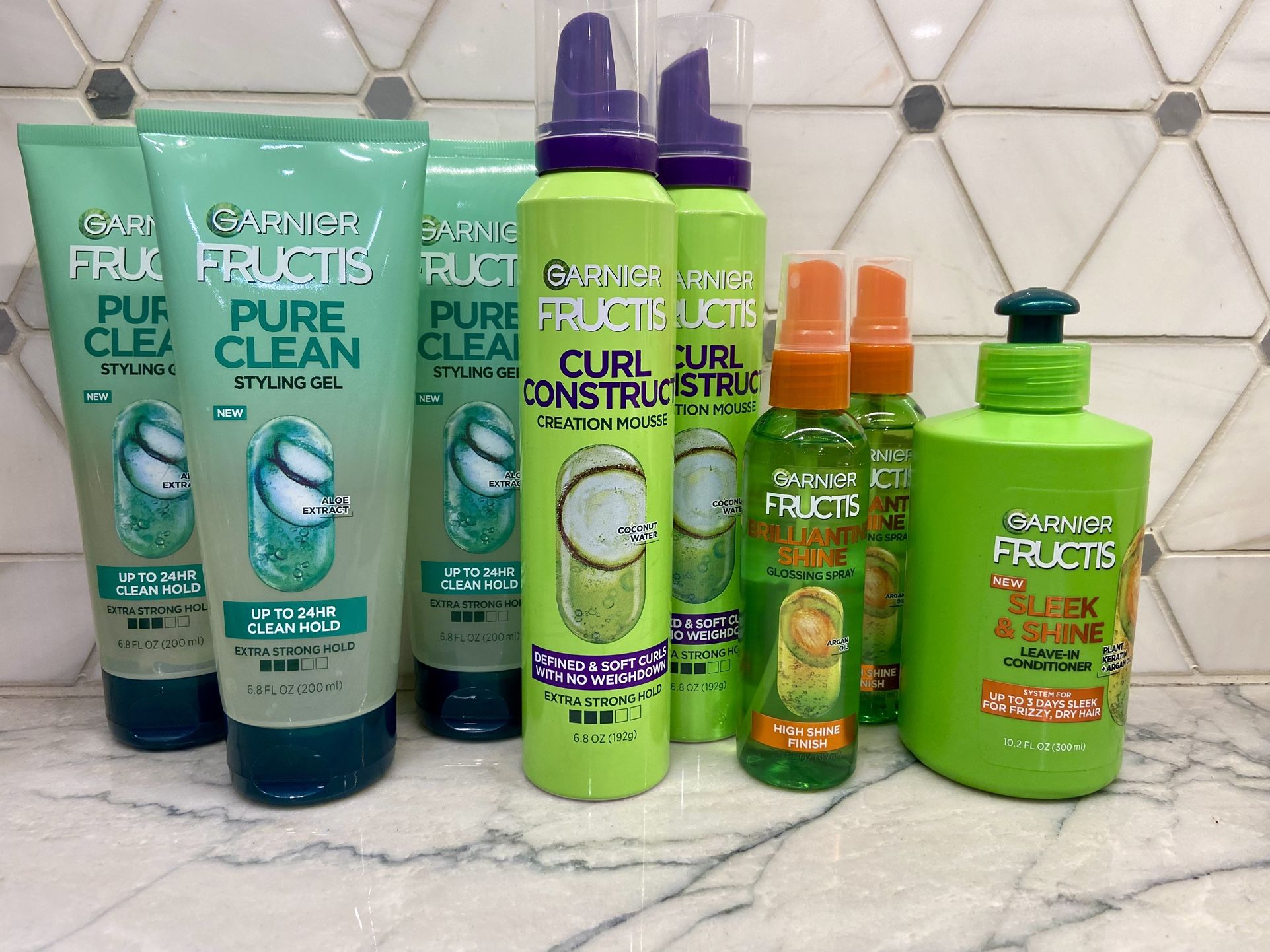 Garnier Fructis stylers: Sleek and Shine Leave In Conditioner with Argan Oil, 10.2 fl oz; Mousse, Hair Gel, Glossing Spray