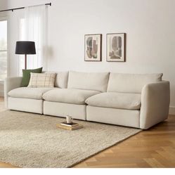 Leigh Silver Ivory 132" Modular Sofa and Leigh Silver Ivory Ottoman retail over