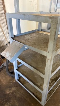 Storage shelf/workshop bench- 4ft tall by 28” square. Fabricated heavy duty steel. Industrial grade.