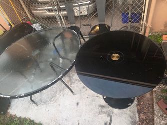 Two outdoors glass tables for sale w two chairs