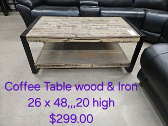Wood and Iron Coffee Table with Lower Shelf We are located at 2811 East Bell road. Another Time Around Furniture.