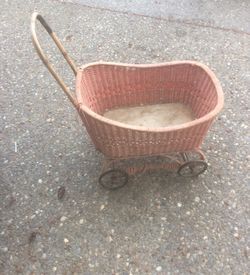 Antique pink doll buggy