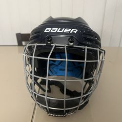 Bauer Prodigy Youth/Junior Blue Helmet Black Cage Size 6"-6 5/8" Valid To 2027. Used in good condition with minor cosmetic blemishes. These blemishes 