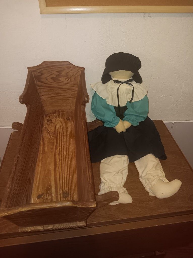 Amish doll and wooden bed
