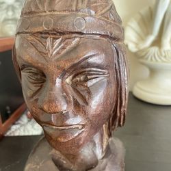 Native American statues perhaps book shelf holders
