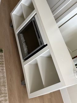 White tv stand with fire place heater