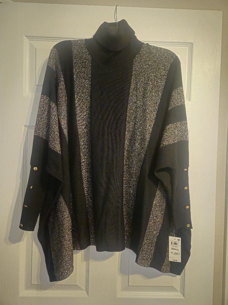Gorgeous Sweater Shawl with tapered sleeves and sparkling Grey stripes, perfect for the holidays!
Paid $59.50 @ Macys, Never worn!