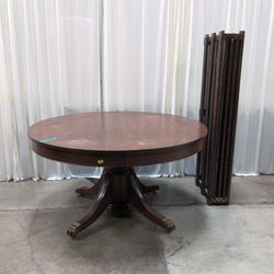 Round Dark Wood Pedestal Dining Table with Claw Feet