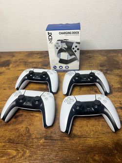4 PlayStation 5 duel sense controllers and charger