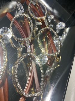 Millionaire Celebrity Glasses “Look Like Money” One (1) Unisex wooden frame with sparkling lab, diamond ice trim. Comes with a white protective case f