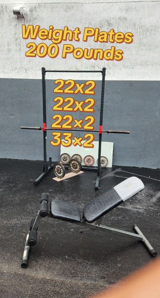 $250. Weight Plates 23²+23²+23²+33³ :198 POUNDS + BAR+ BENCH + Rack / PULL Ups + J Hooks.DeliveryFee