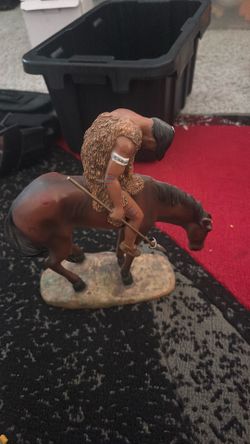 Native American man on horse  statue