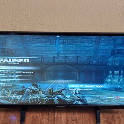 (2) 32" Flat-screen TV's both with User's Manuals and Remote Controls 