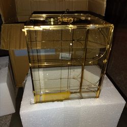 Golden glass litter box decorative with key and lock