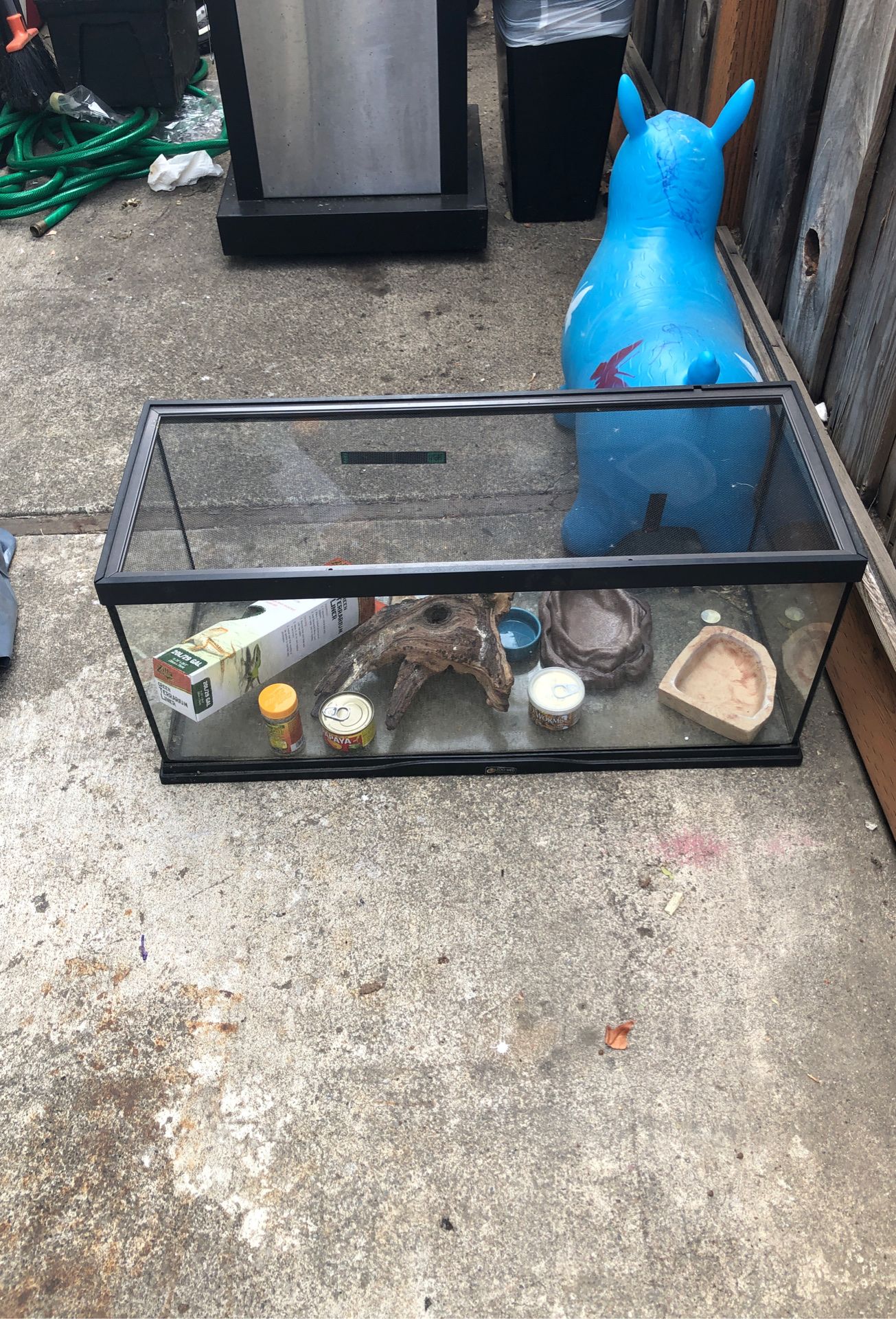 Zoo med tank approx. 20 gal. With slide on screen top and few accessories. Great for a baby bearded dragon, small reptiles, and maybe for a fish aqua