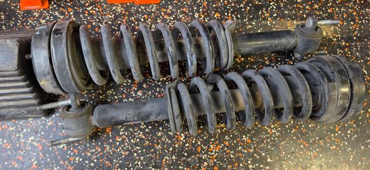F-150 OEM Struts with 2" leveling kit.