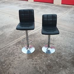 Pair Of Black And Chrome Adjustable Bar Stools 