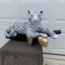 Snow Leopard On The Log Statue 