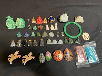 Different stone and other Buddhas, cloisonné, bone, and more Asian items.