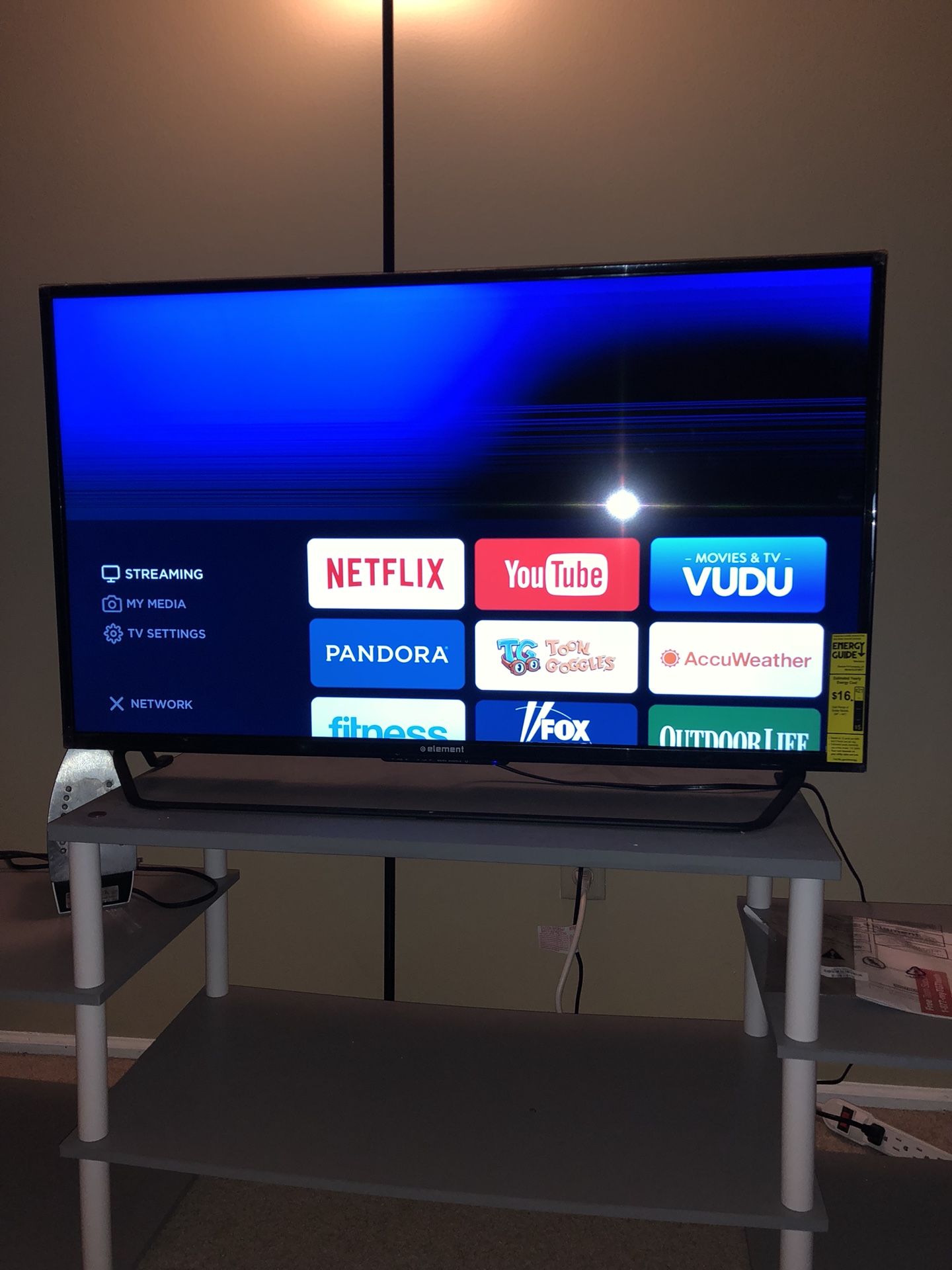 40” Element Tv with a cracked screen and Tv stand