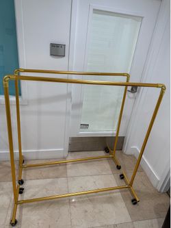 2 gold clothing rack