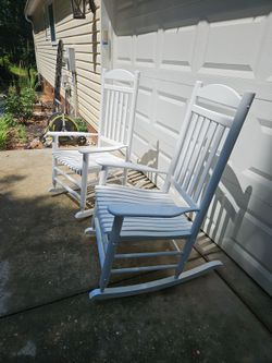 2 white patio rocking chairs