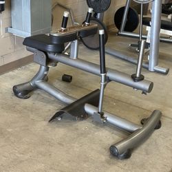 Hammer Strength weighted seated calf raise machine