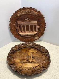 Two Carved German souvenir wall plate 9” inches each