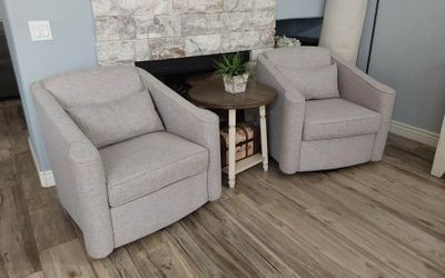 Two Beautiful gray swivel accent chairs