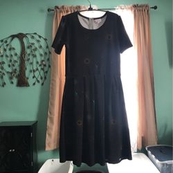 Black Dress With Starburst Pattern With pockets. size small 