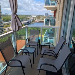 4 Patio Chairs, 2 End Tables, Umbrella
