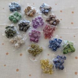 Dungeons & Dragons or role playing game enthusiast. 
7 Piece  Marble Polyhedral Dice Set 
