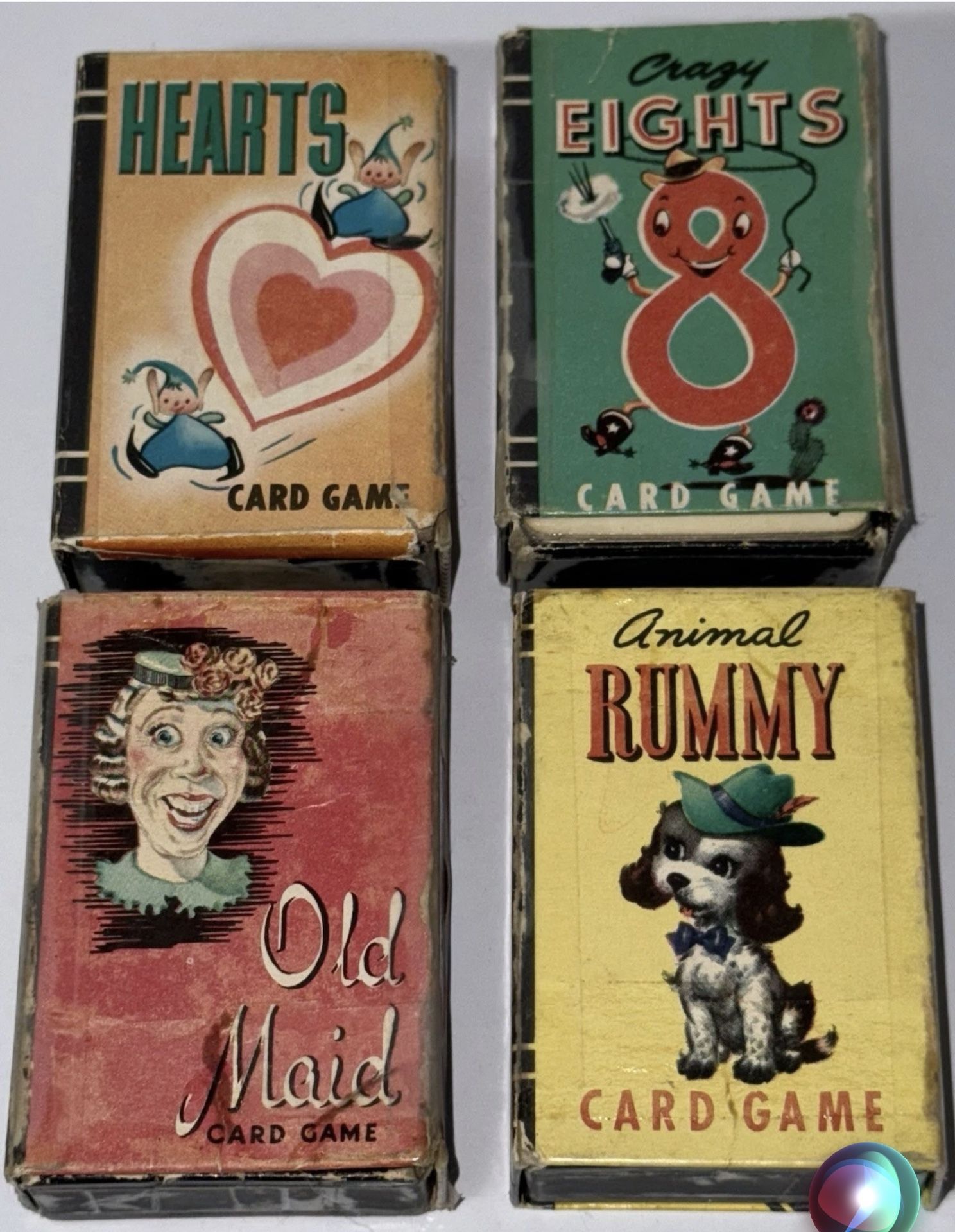 4 sets of vintage card games complete in boxes. Includes Old Maid, Animal Rummy, 8’s, and Hearts