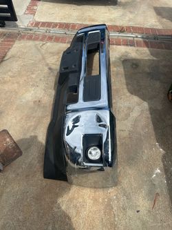 Chrome front bumper Chevrolet Silverado hd trucks. From 2015 to 2019 This unit is made of steel with a chrome finish and black plastic trim.  It inclu