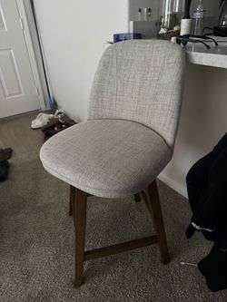 2 wood swivel chairs