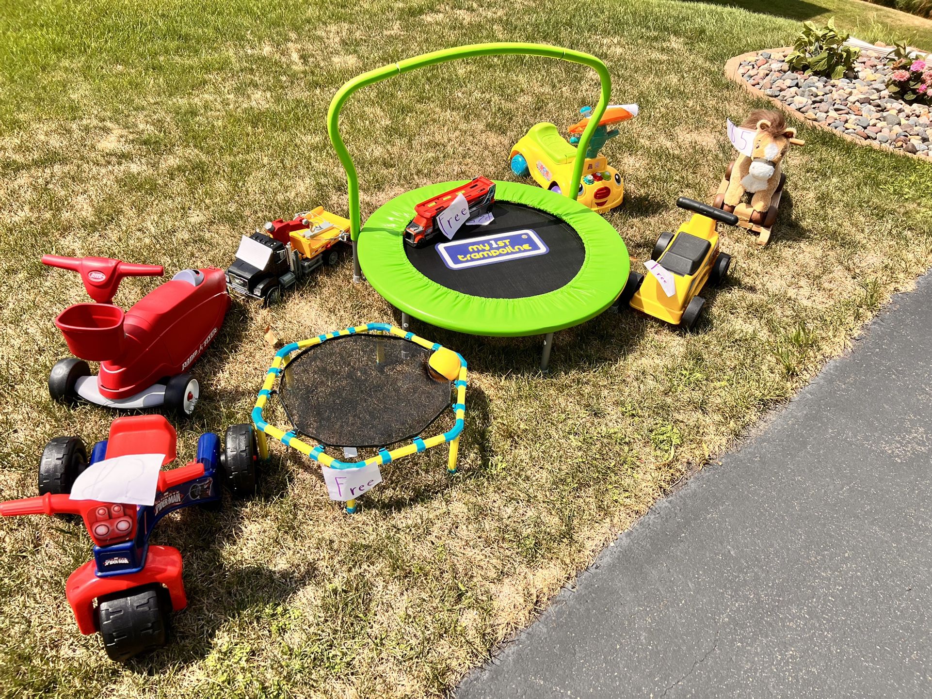 Toys For Sale- Mini Trampoline -$25, Radio Flyer Convertible Tricycle -$20,Pony -$5, Spider-Man Ride-$5, Construction Truck -$10, Music Ride-$5