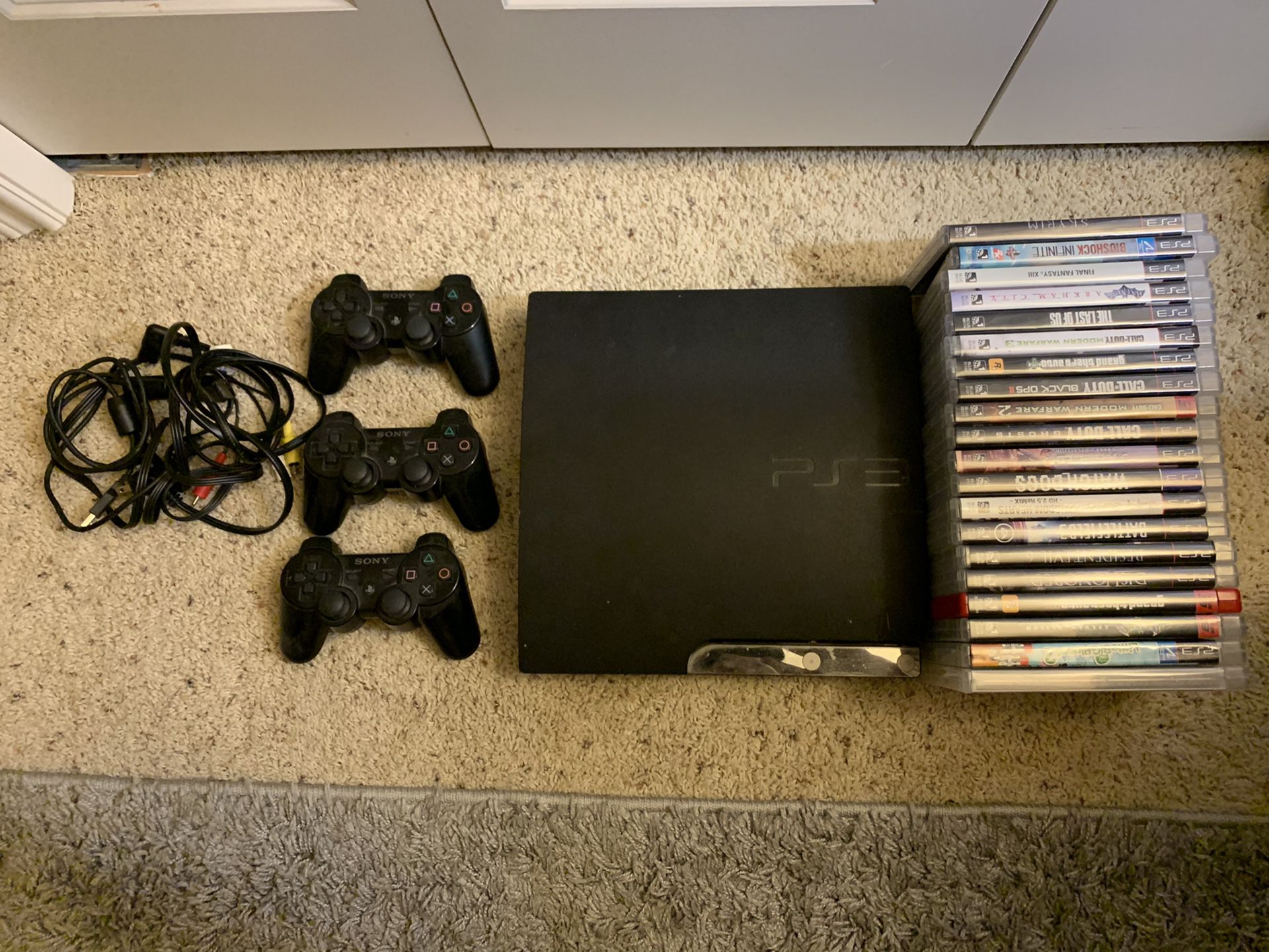 PS3 with controllers and 20 games
