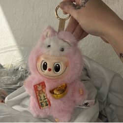 This is a POP MART THE MONSTERS Pin for Love Series vinyl plush pendant keychain.