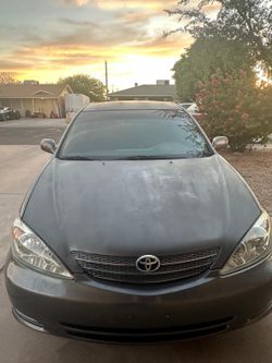 Gray 2004 Toyota Camry CE. Sedan 4D