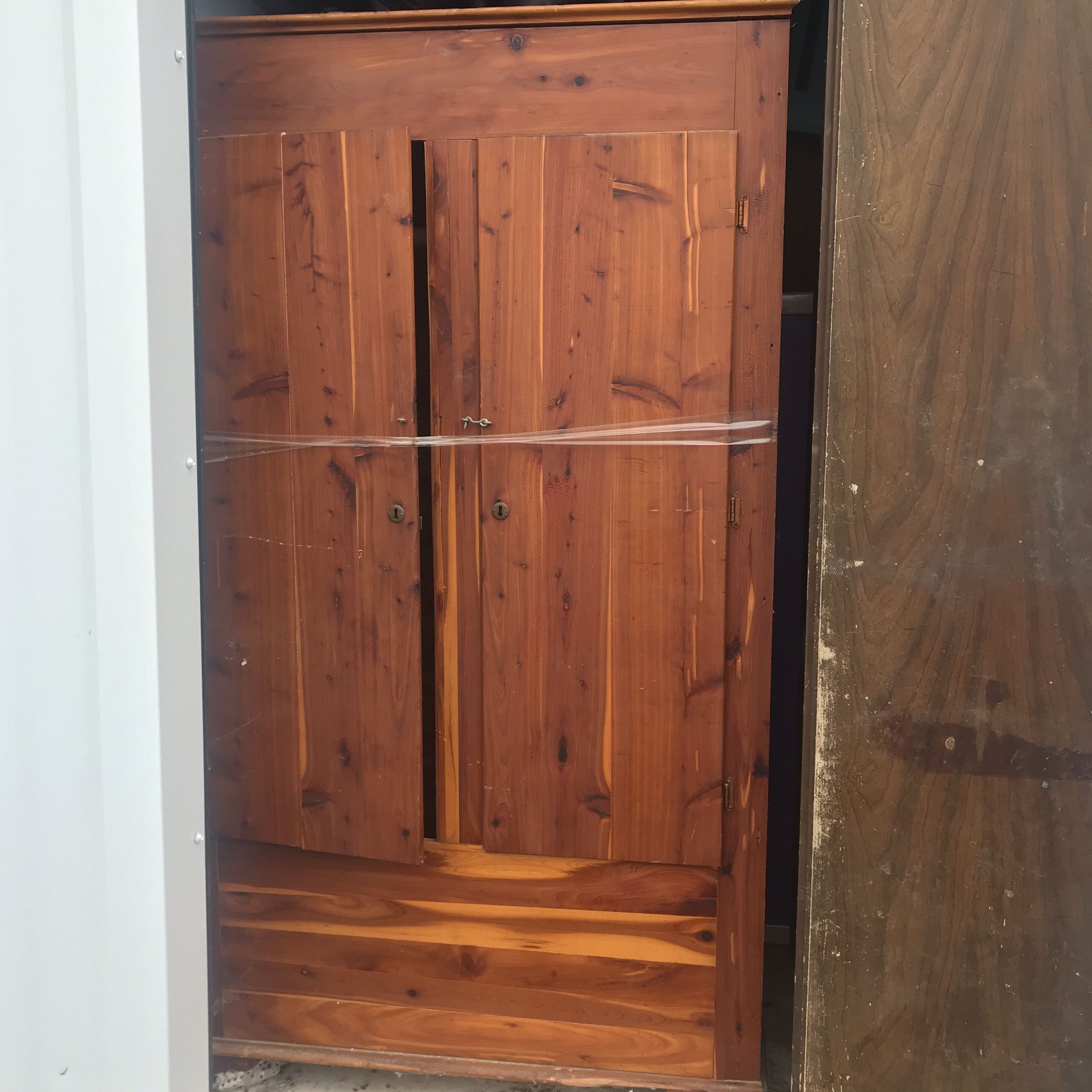 Cedar wardrobe. Has a few scratches and needs a new latch. Easy fix!