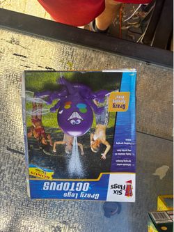 flatable purple octopus water sprinkler from Six Flags has multiple spraying arms