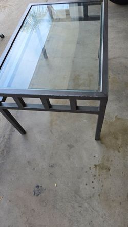 Metal table with glass