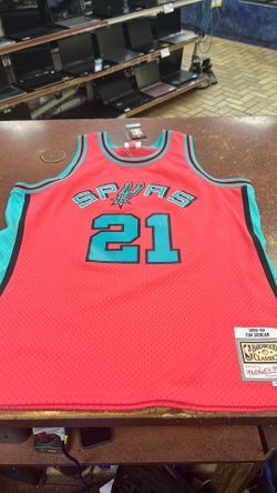 Mitchell & ness 1998-99 Tim Duncan pink jersey w/ teal lettering