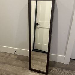 Mirror with hidden storage for jewelry 