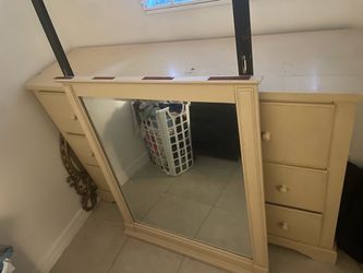 Brown dresser with the mirror to go with it