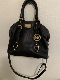 Name: Purse Brand: Michael Kors. It’s also in good condition; not ripped, not scratched